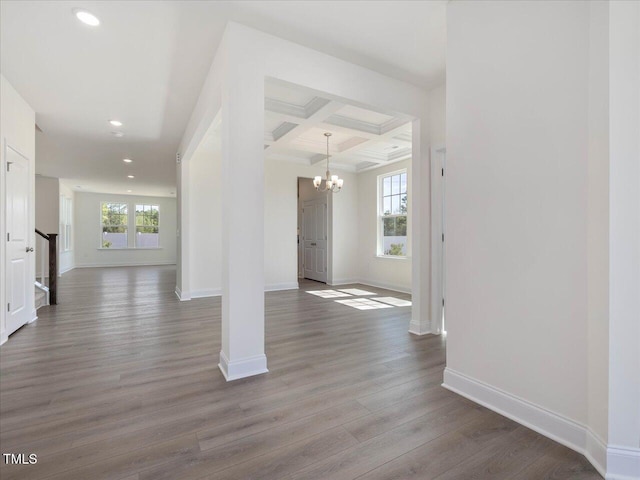 33 Celtic Ln, Lillington, NC 27546 - interior space featuring coffered ceiling, baseboards, recessed lighting, wood finished floors, and a notable chandelier
