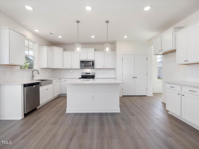 33 Celtic Ln, Lillington, NC 27546 - kitchen featuring tasteful backsplash, stainless steel appliances, light countertops, and a sink