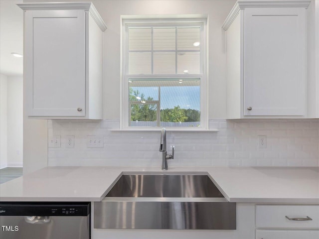 33 Celtic Ln, Lillington, NC 27546 - kitchen with stainless steel dishwasher, a sink, backsplash, and light countertops