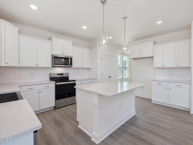 33 Celtic Ln, Lillington, NC 27546 - kitchen with white cabinetry, backsplash, appliances with stainless steel finishes, and light wood-style floors