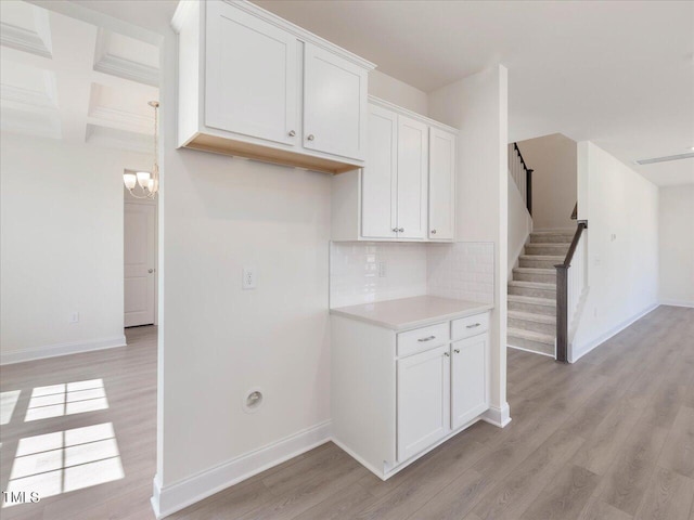 33 Celtic Ln, Lillington, NC 27546 - kitchen featuring baseboards, white cabinets, and light wood-style flooring
