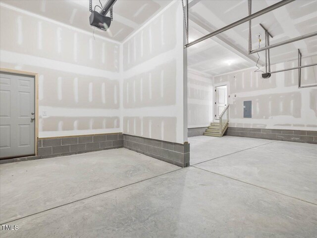 33 Celtic Ln, Lillington, NC 27546 - garage featuring a garage door opener and electric panel