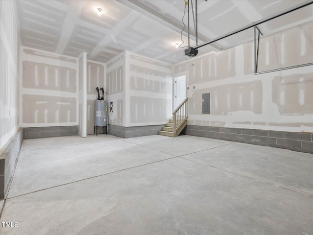 33 Celtic Ln, Lillington, NC 27546 - garage with electric panel, a garage door opener, and electric water heater