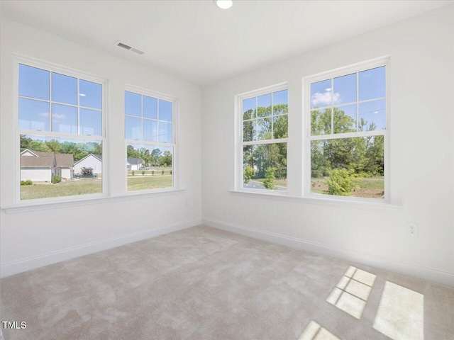 33 Celtic Ln, Lillington, NC 27546 - carpeted empty room featuring visible vents and baseboards