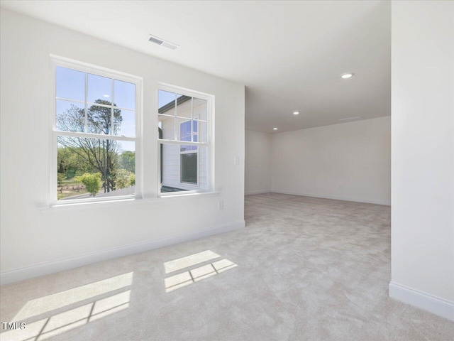 33 Celtic Ln, Lillington, NC 27546 - empty room featuring baseboards, visible vents, carpet, and plenty of natural light