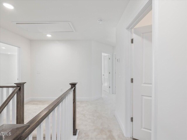 33 Celtic Ln, Lillington, NC 27546 - hallway with recessed lighting, light colored carpet, attic access, an upstairs landing, and baseboards