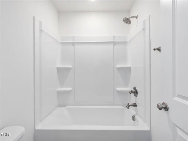 33 Celtic Ln, Lillington, NC 27546 - bathroom featuring shower / washtub combination and toilet