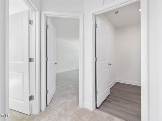 33 Celtic Ln, Lillington, NC 27546 - corridor featuring visible vents, light carpet, and baseboards