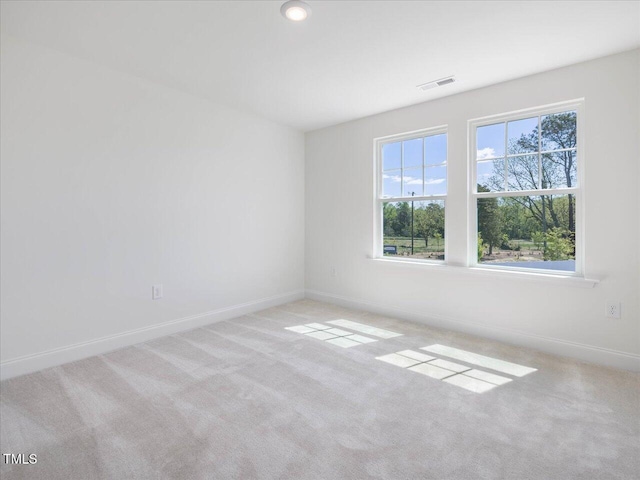 33 Celtic Ln, Lillington, NC 27546 - carpeted spare room featuring visible vents and baseboards