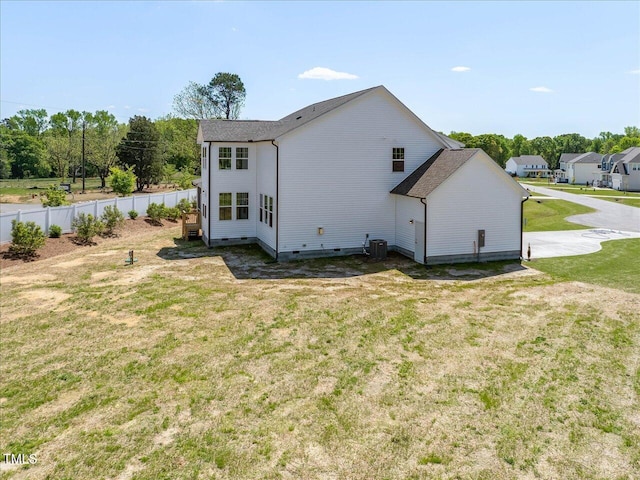 33 Celtic Ln, Lillington, NC 27546 - back of house with fence, cooling unit, a lawn, and crawl space