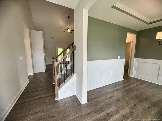 374 Whitestone Dr, Fayetteville, NC 28312 - spare room featuring a ceiling fan, dark wood finished floors, stairway, a wainscoted wall, and vaulted ceiling