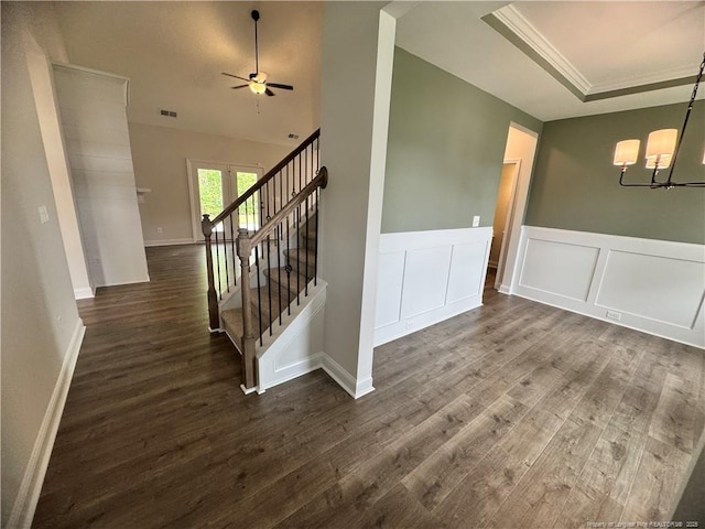 374 Whitestone Dr, Fayetteville, NC 28312 - interior space featuring a chandelier, dark wood-type flooring, stairway, wainscoting, and a decorative wall