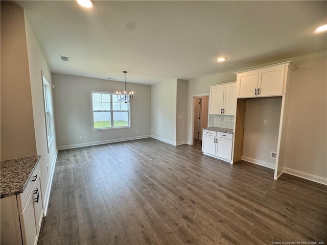 374 Whitestone Dr, Fayetteville, NC 28312 - unfurnished living room with a chandelier, dark wood-type flooring, and recessed lighting