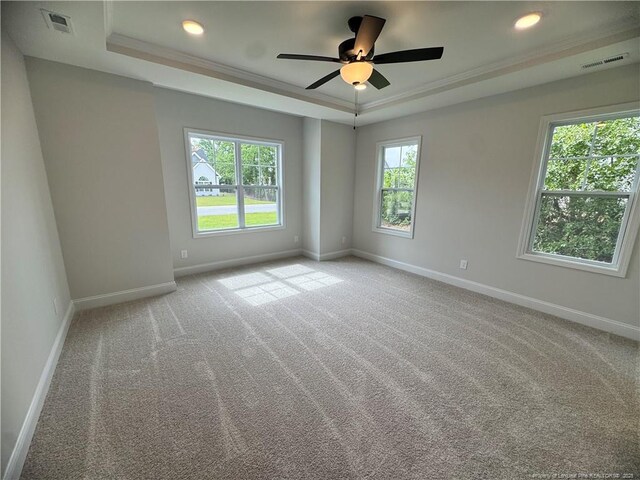 374 Whitestone Dr, Fayetteville, NC 28312 - empty room featuring a raised ceiling, crown molding, carpet, ceiling fan, and recessed lighting