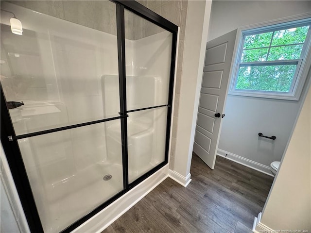 374 Whitestone Dr, Fayetteville, NC 28312 - bathroom featuring wood finished floors and a stall shower