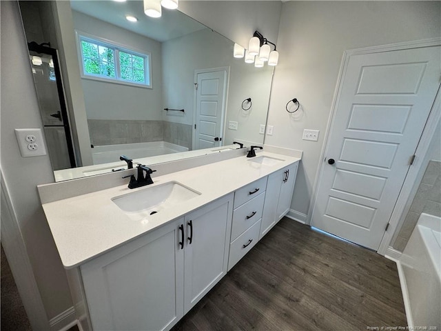 374 Whitestone Dr, Fayetteville, NC 28312 - full bath with a garden tub, double vanity, and wood finished floors