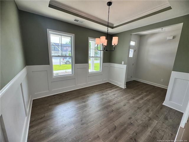 374 Whitestone Dr, Fayetteville, NC 28312 - unfurnished dining area featuring a tray ceiling, a chandelier, dark wood finished floors, a wainscoted wall, and ornamental molding