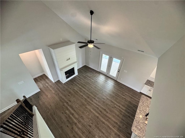 374 Whitestone Dr, Fayetteville, NC 28312 - unfurnished living room featuring a ceiling fan, vaulted ceiling, dark wood finished floors, and a fireplace