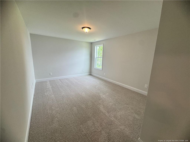 374 Whitestone Dr, Fayetteville, NC 28312 - spare room featuring baseboards and carpet