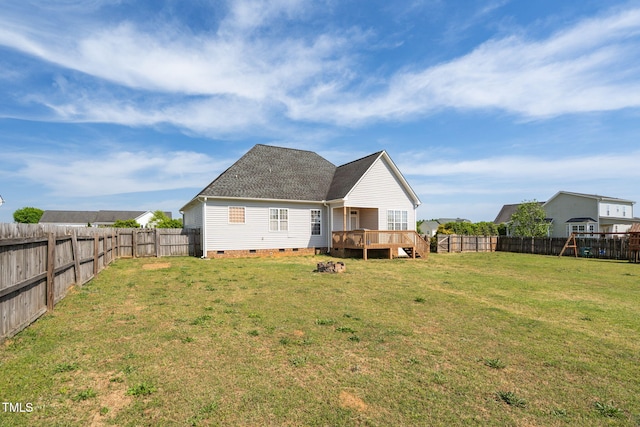 back of property featuring a fenced backyard, a wooden deck, a yard, and crawl space