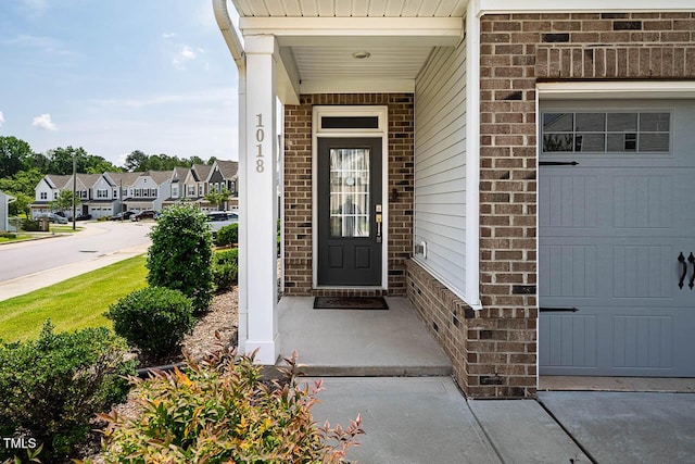 1018 Excite Ave, Morrisville, NC 27560 - property entrance with brick siding, a residential view, and an attached garage