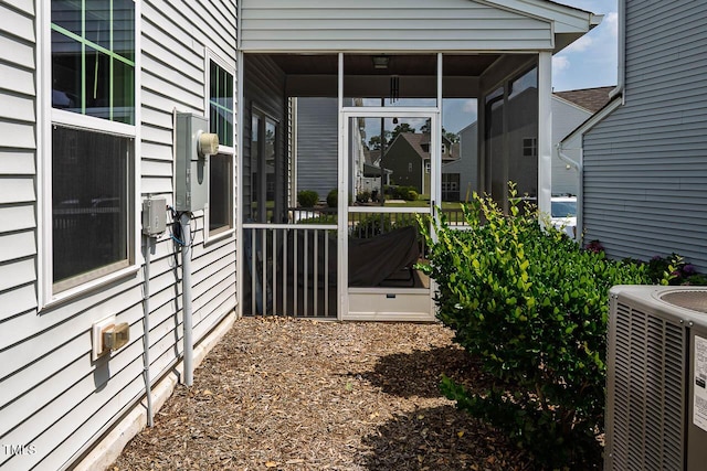 1018 Excite Ave, Morrisville, NC 27560 - view of side of home with a central air condition unit and a sunroom