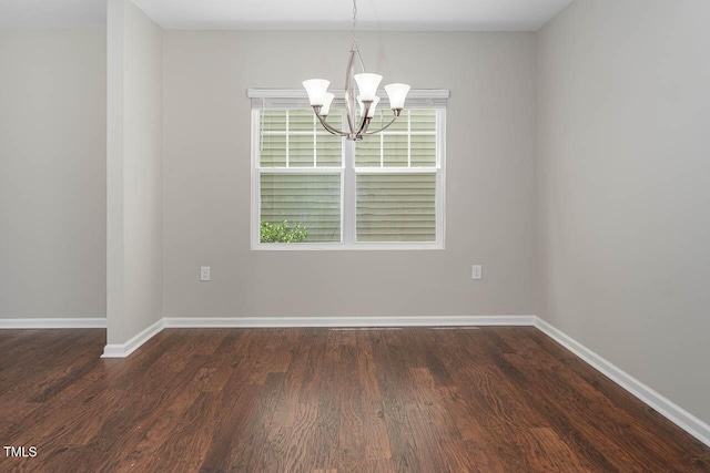 1018 Excite Ave, Morrisville, NC 27560 - spare room featuring a chandelier and dark wood finished floors