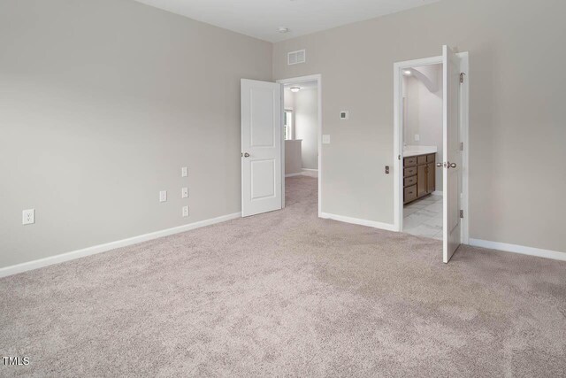 1018 Excite Ave, Morrisville, NC 27560 - unfurnished bedroom featuring light carpet and baseboards