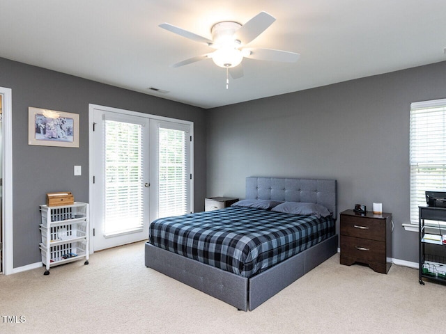 bedroom with carpet floors, access to outside, french doors, and visible vents