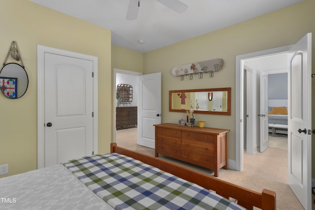 bedroom with baseboards, tile patterned flooring, carpet flooring, and ceiling fan