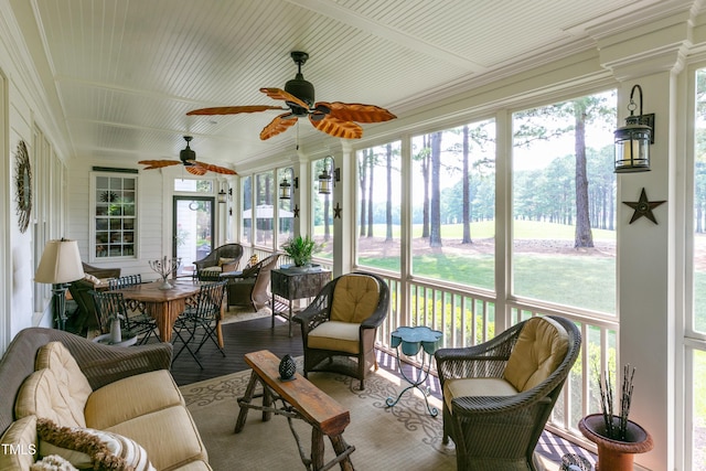 sunroom / solarium with plenty of natural light and a ceiling fan