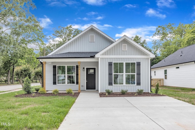 401 N Raiford St, Selma, NC 27576 - modern inspired farmhouse with board and batten siding, roof with shingles, and a porch