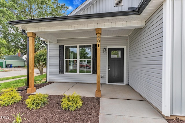401 N Raiford St, Selma, NC 27576 - doorway to property with board and batten siding and a porch