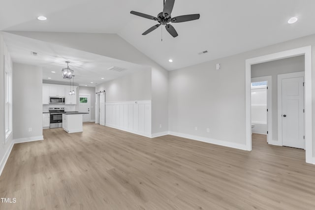 401 N Raiford St, Selma, NC 27576 - unfurnished living room featuring light wood-style floors, a ceiling fan, lofted ceiling, baseboards, and recessed lighting