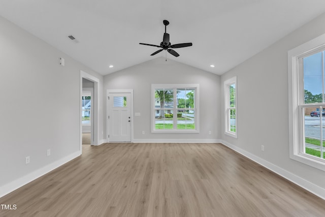 401 N Raiford St, Selma, NC 27576 - unfurnished living room with light wood-style flooring, healthy amount of natural light, a ceiling fan, baseboards, and lofted ceiling