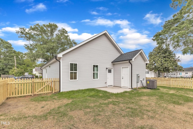 401 N Raiford St, Selma, NC 27576 - back of property featuring central AC and a patio