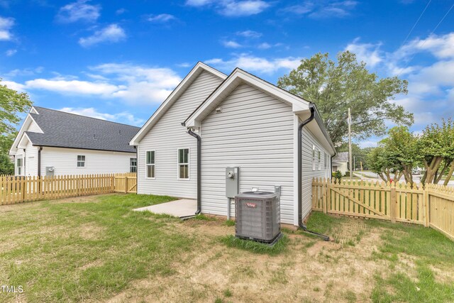 401 N Raiford St, Selma, NC 27576 - rear view of house with cooling unit and a gate