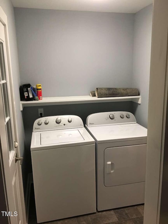 laundry room with washing machine and clothes dryer and laundry area