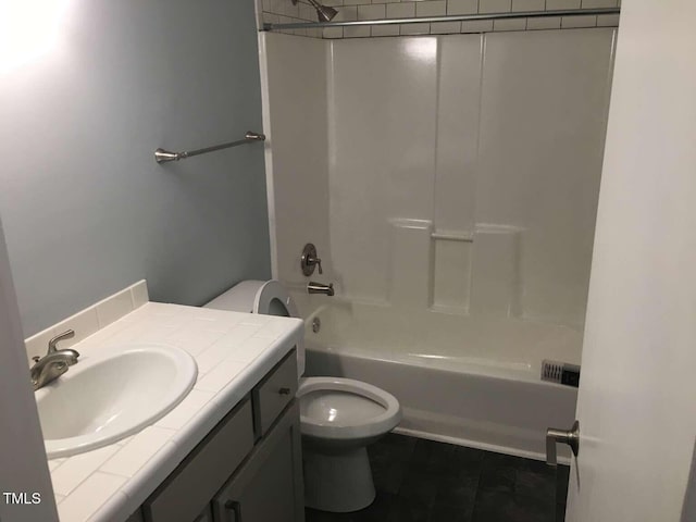 full bath with toilet, tile patterned floors, vanity, and shower / bathing tub combination