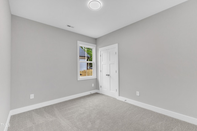 405 N Raiford St, Selma, NC 27576 - carpeted empty room featuring baseboards