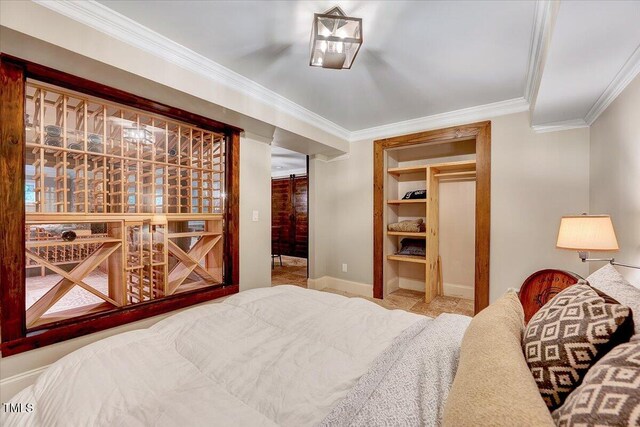 bedroom featuring baseboards and ornamental molding