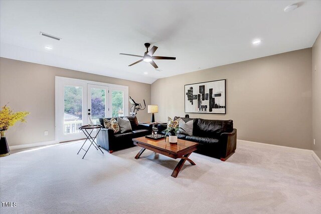 living area with a ceiling fan, french doors, visible vents, carpet floors, and baseboards