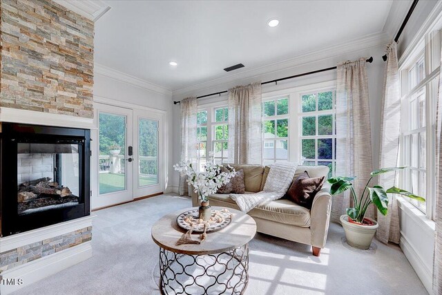 sunroom / solarium with crown molding, recessed lighting, french doors, and carpet