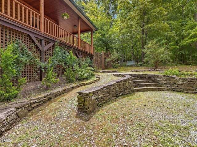 view of yard with a wooden deck