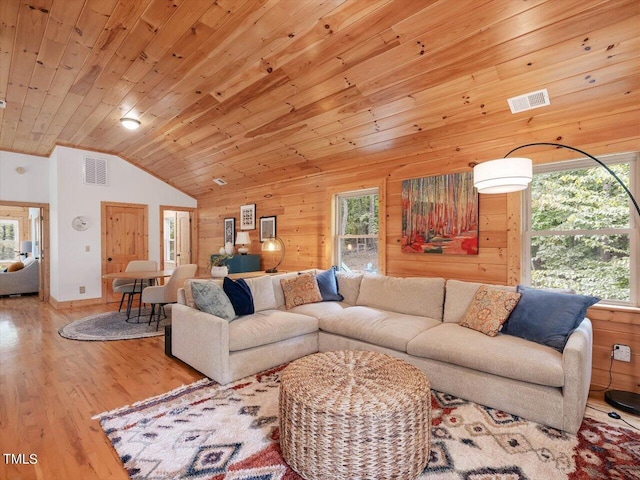 living area featuring visible vents, wooden ceiling, wood finished floors, and vaulted ceiling