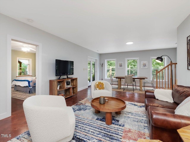 living area with baseboards and recessed lighting