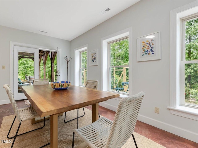 dining area featuring baseboards and visible vents