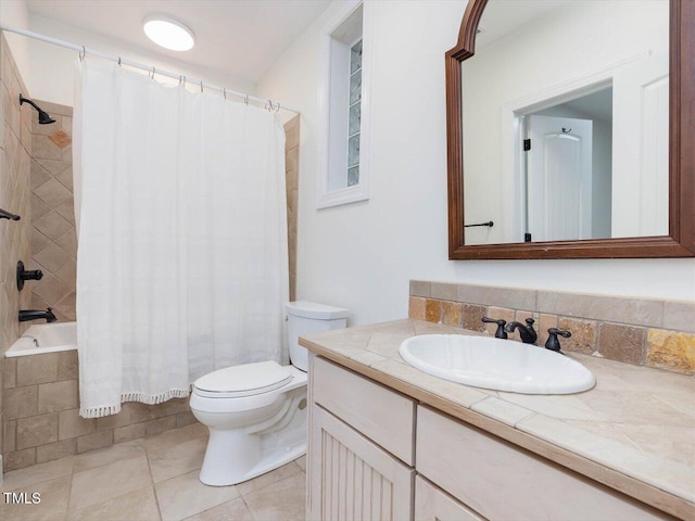 full bath featuring vanity, shower / tub combo with curtain, tile patterned floors, and toilet