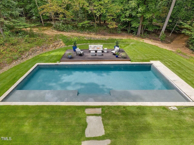 outdoor pool with an outdoor hangout area and a lawn