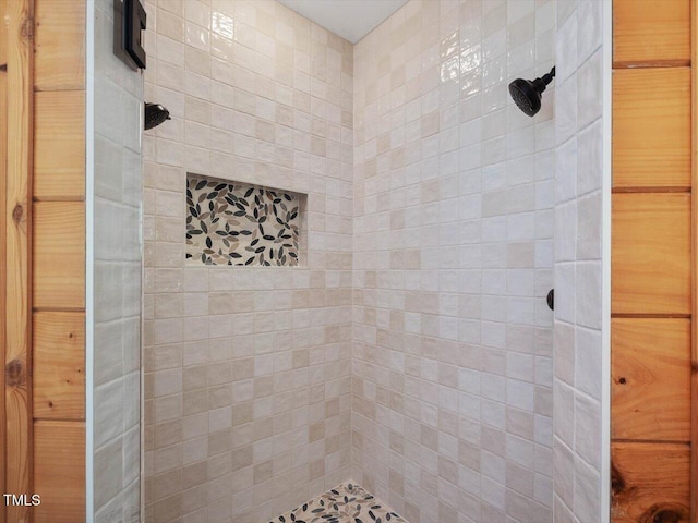 full bathroom with a tile shower